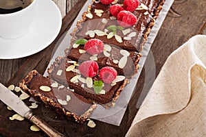 Vegan chocolate tart with almonds