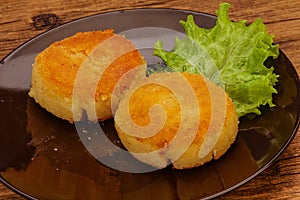 Vegan cuisine - Potato cutlet in the plate