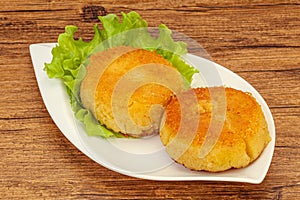 Vegan cuisine - Potato cutlet in the plate