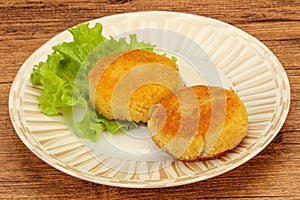 Vegan cuisine - Potato cutlet in the plate