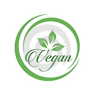 Vegan cursive text logo with green leaves for organic Vegetarian friendly diet- Universal vegetarian symbol photo