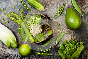 Vegan, detox green Buddha bowl recipe with quinoa, cucumber, broccoli, asparagus and sweet peas.