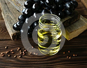 Vegan food concept. Glass jar of grape seed oil.