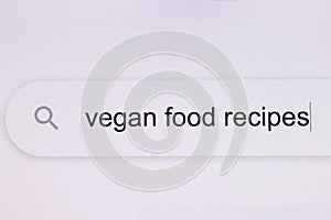 Vegan food recipes - pc screen internet browser search engine bar typing vegan food recipes related question. Typing the