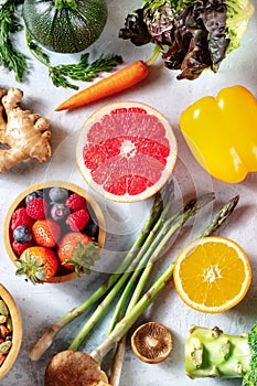 Vegan food, shot from above. Grapefruit, asparagus, and other superfoods