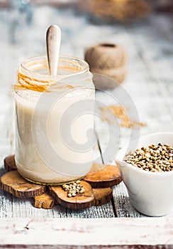 Vegan fresh milk from hemp seeds in a glass jar