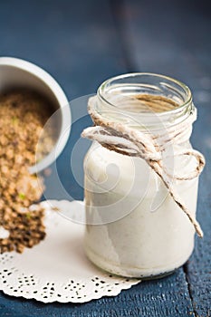 Vegan fresh milk from hemp seeds in a glass jar, clean eating
