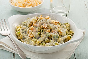 Vegan gnocchi casserole on wooden background