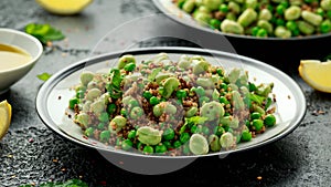 Vegan Green broad beans and quinoa salad with sweet peas and mint. Healthy food.