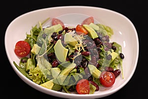 Vegan green salad with avocado and beans