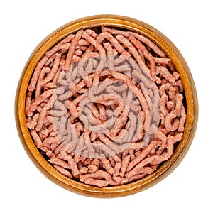 Vegan ground meat, a substitute for minced meat, in a wooden bowl photo