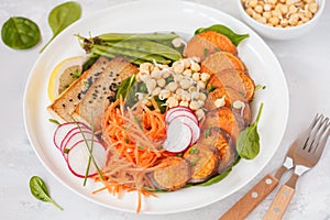 Vegan lunch, salad with vegetables, tofu, baked sweet potato, sp