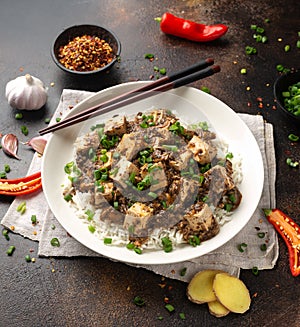 Vegan Mapo tofu with mushroom and rice. Asian, Chinese food