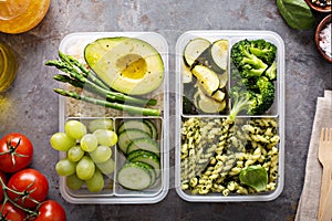 Vegan meal prep containers with pasta and vegetables