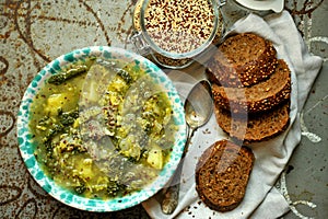 Vegan meal: quinoa soup with organic cabbage and potatoes