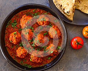Vegan meatballs curry served with flatbread