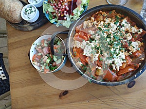 Vegan Mediterranean breakfast with Shakshuka salads and bread