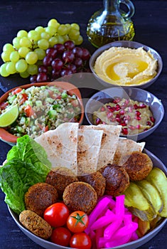 Vegan mediterranean lunch platter with olive oil jug