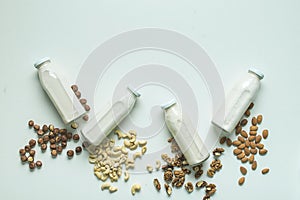 Vegan milk in glass jar on white background