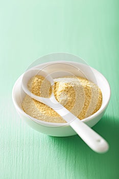 Vegan nutritional yeast flakes in bowl