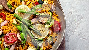 Vegan Paella on gray background