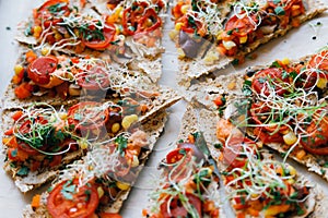 Vegan pizza with flowers, seeds and live plants