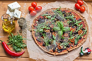 Vegan pizza marinara with spelt dough top view