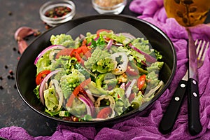 Vegan salad of fresh vegetables and cabbage romanesko.