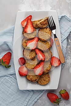 Vegan sweet tofu fritters with strawberries, vertical. Healthy v