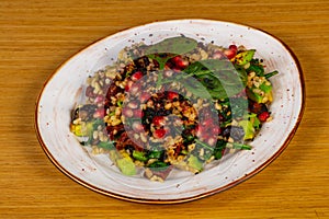 Vegan tabule with tomato and avocado photo