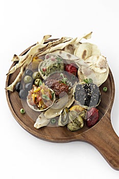 vegan tapas snacks sharing platter board on white background