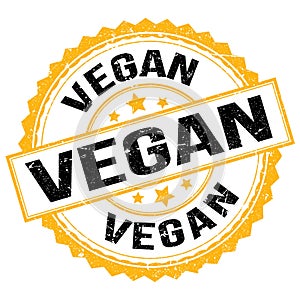 VEGAN text on yellow-black round stamp sign