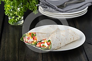 Vegan tofu wraps with pepper, corn, tomatoes and spinach