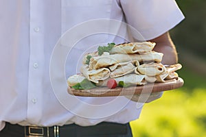 Vegan vegetable wrap with lettuce, cucumber and tomatoes sliced in half