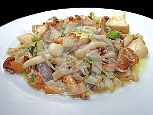 Vegan and Vegetarian healthy menu: Stir fried varieties of mushrooms and tofu