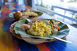 Vegan or vegetarian restaurant dishes side view, hot spicy indian rice in bowl. Healthy traditional eastern local food