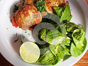 Vegan / Vegetarian : Rosti / RÃÂ¶sti smashed potatoes pancake with herbs, fresh spinach and lemon photo
