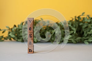 Vegan word on a green yellow background