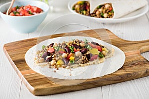 Vegan wraps with lentil, chickpea peppers and kidney bean