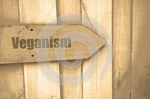 Veganism sign on wood