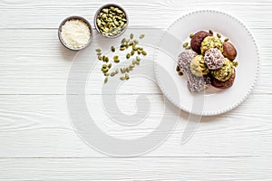 Vegen energy balls with pumpkin seeds and coconut, overhead view