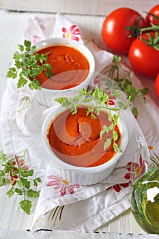 Vegetable appetizer: tomato soufflÐµ, bunch of tomatoes and olive oil