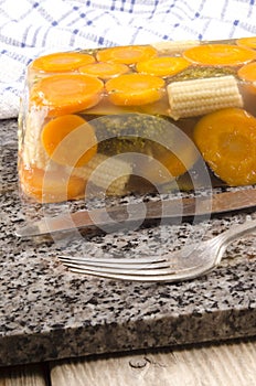 Vegetable in aspic and cutlery