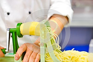 Vegetable Blade Spiralizer, Spiral vegetable slicer with potato spaghetti on table