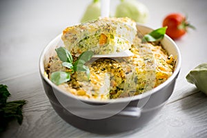 vegetable casserole of patissons, zucchini, carrots in a ceramic form .