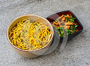 vegetable chowmein with chicken chili dry served in bowl isolated on background top view of asian food