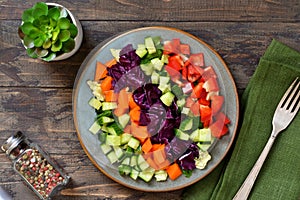 Vegetable cobs salad with stamates, cucumber, pepper, spinach. Salad is a rainbow