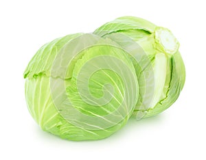 Vegetable composition with whole fresh cabbage isolated on a white background.
