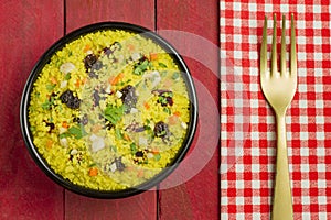 Vegetable couscous in a black bowl