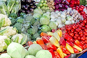 Vegetable farmer market counter. Colorful heap of various fresh organic healthy vegetables at grocery store. Healthy